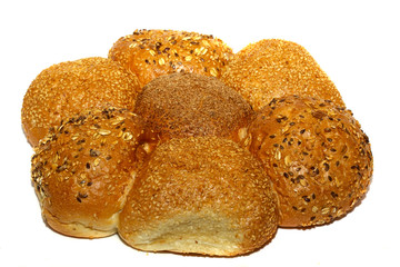 Loaf of bread and rolls isolated on white