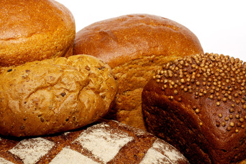 loafs of whole wheat and rye bread and isolated