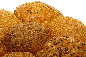 Loaf of bread and rolls isolated on white