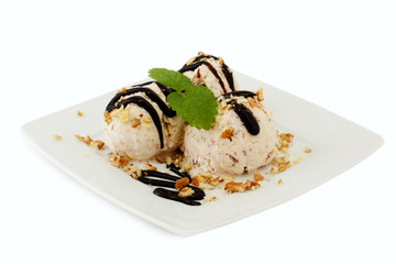 ice cream with nuts and  chocolate topping