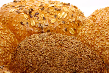 Loaf of bread and rolls isolated on white
