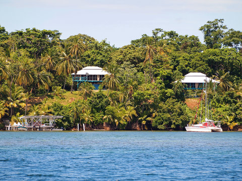 Caribbean coast with tropical house and lush vegetation, archipelago of Bocas del Toro, Panama, Central America