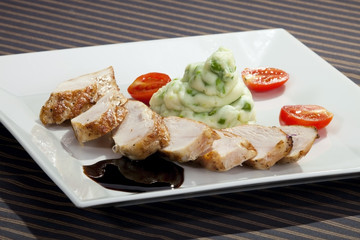 Pork tenderloin w potato puree with young peas