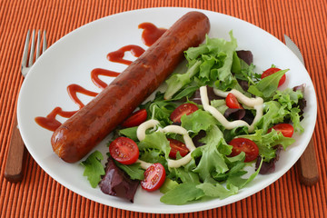 Fried sausage with salad
