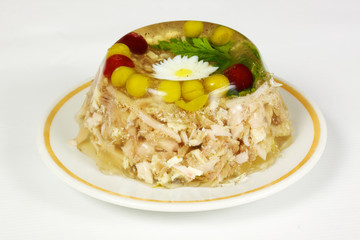 Aspic from chicken meat decorated with eggs and parsley
