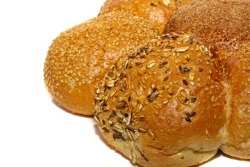 Loaf of bread and rolls isolated on white