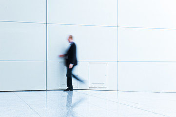 businessman walking by