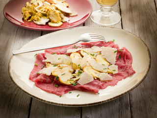 beef carpaccio with slice ovum mushroom and  parmesan flake