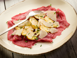 beef carpaccio with slice ovum mushroom and  parmesan flake