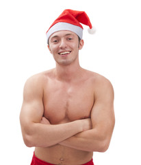 Sexy muscular man wearing a Santa Claus hat