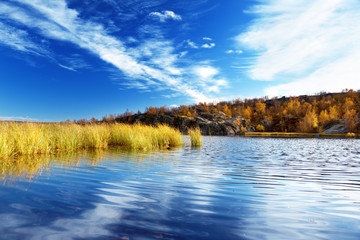 Fototapeta na wymiar mountain autumn lake in north of Russia