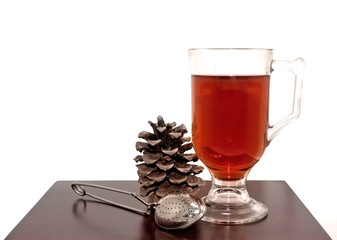 Seasonal Tea Scene With Pine Cone