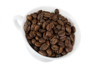 Roasted coffee beans in cup isolated on white