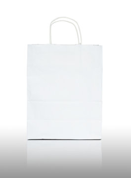 White paper bag on reflect floor and white background