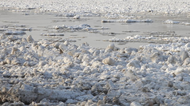 Chunks of ice flow down the river