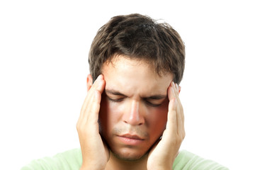 young man suffering from a headache isolated on white background