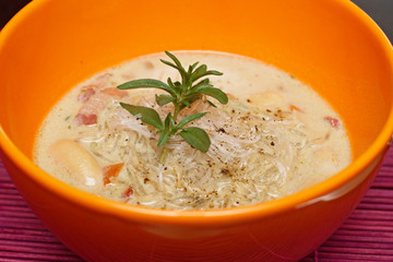 fresh lentil soup in an orange bowl