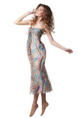 Young charming female in chiffon dress jumping