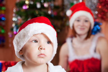 Fototapeta na wymiar Little boy in Christmas hat