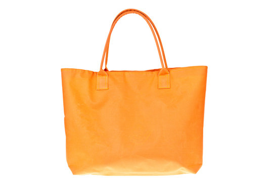Colorful orange cotton bag on white isolated background.