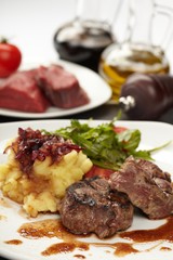 Beef steaks with vegetables