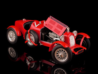 vintage red car on black background