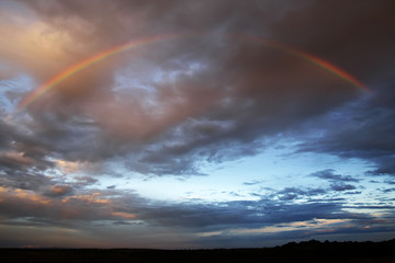 Fototapeta na wymiar Rainbow at sunset