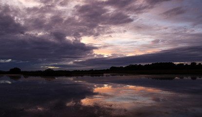 Fototapeta na wymiar Sunset reflected in a lake