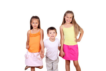 Obraz premium Two girls and a boy together in studio