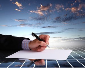 Businessman hand signing documents