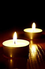 a row of votives with short depth of field