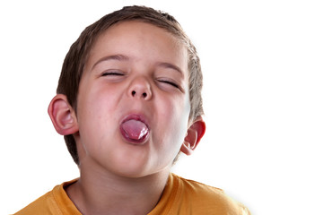boy sticking out his tongue