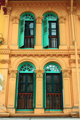 Fototapeta na wymiar Green wooden windows from singapore china town.