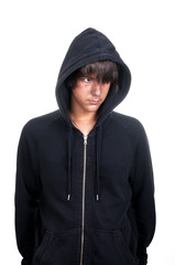 Closeup of a teenager wearing a hoodie, underlit