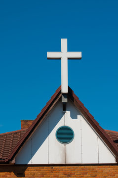 white cross a symbol of hope against blue sky