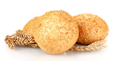 buns with sesame seeds and spikelets isolated on white