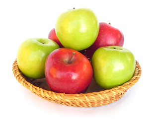 Apples on a wicker dish.