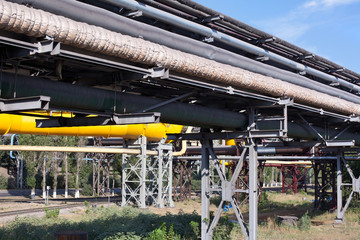 Naklejka premium Plenty of gas and oil pipelines at a industrial factory