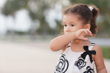 Child wiping her mouth