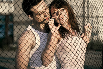 couple standing near lattice