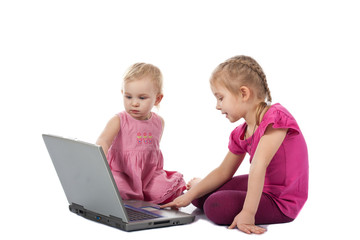 Kids playing computer game on laptop