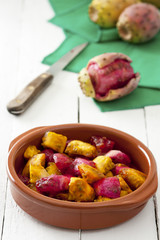 Sliced Indian Figs in a Bowl on White Wood