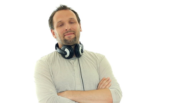 Young handsome man with headphones on his neck, isolated