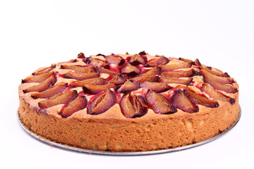 Plum pie on a white background