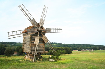 Fototapeta na wymiar Evening landscape with windmill.