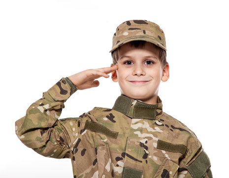 Saluting soldier. Young boy
