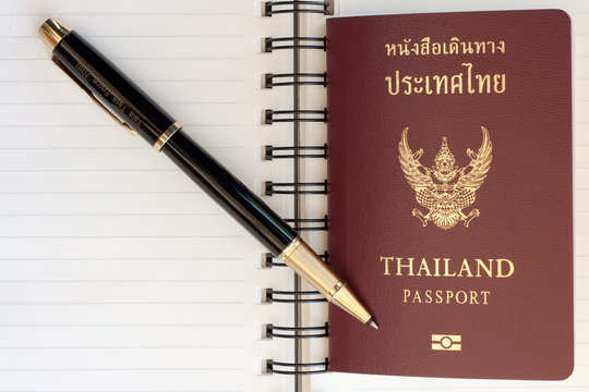 Thailand passport and pen