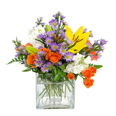 Colorful flower arrangement centerpiece in square glass vase