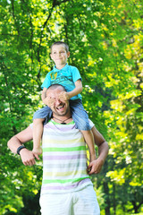 Fototapeta premium happy father and son have fun at park