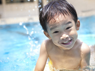 Fototapeta na wymiar happy Boy in Swimming Pool